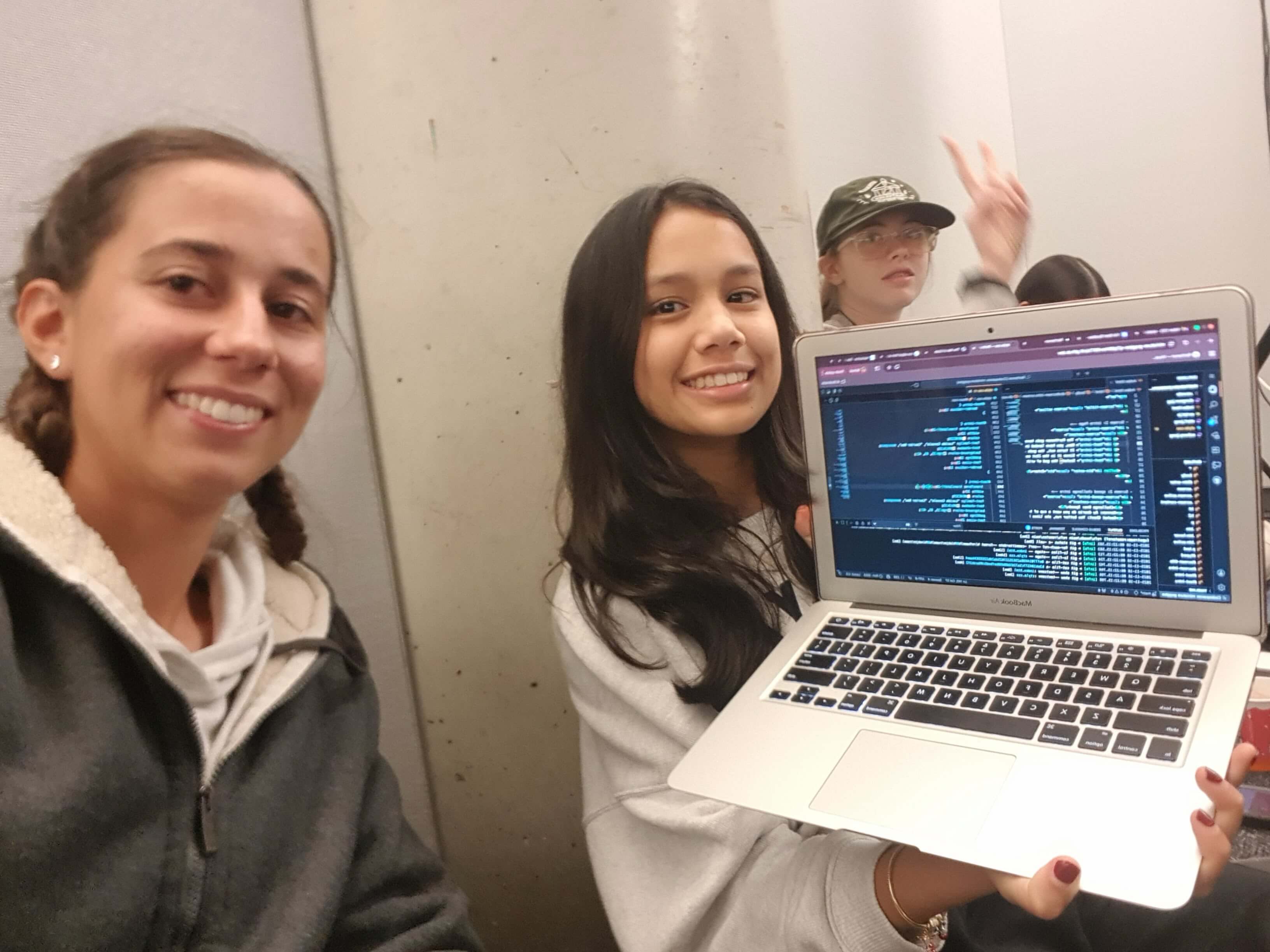 Two attendees showing off their code.